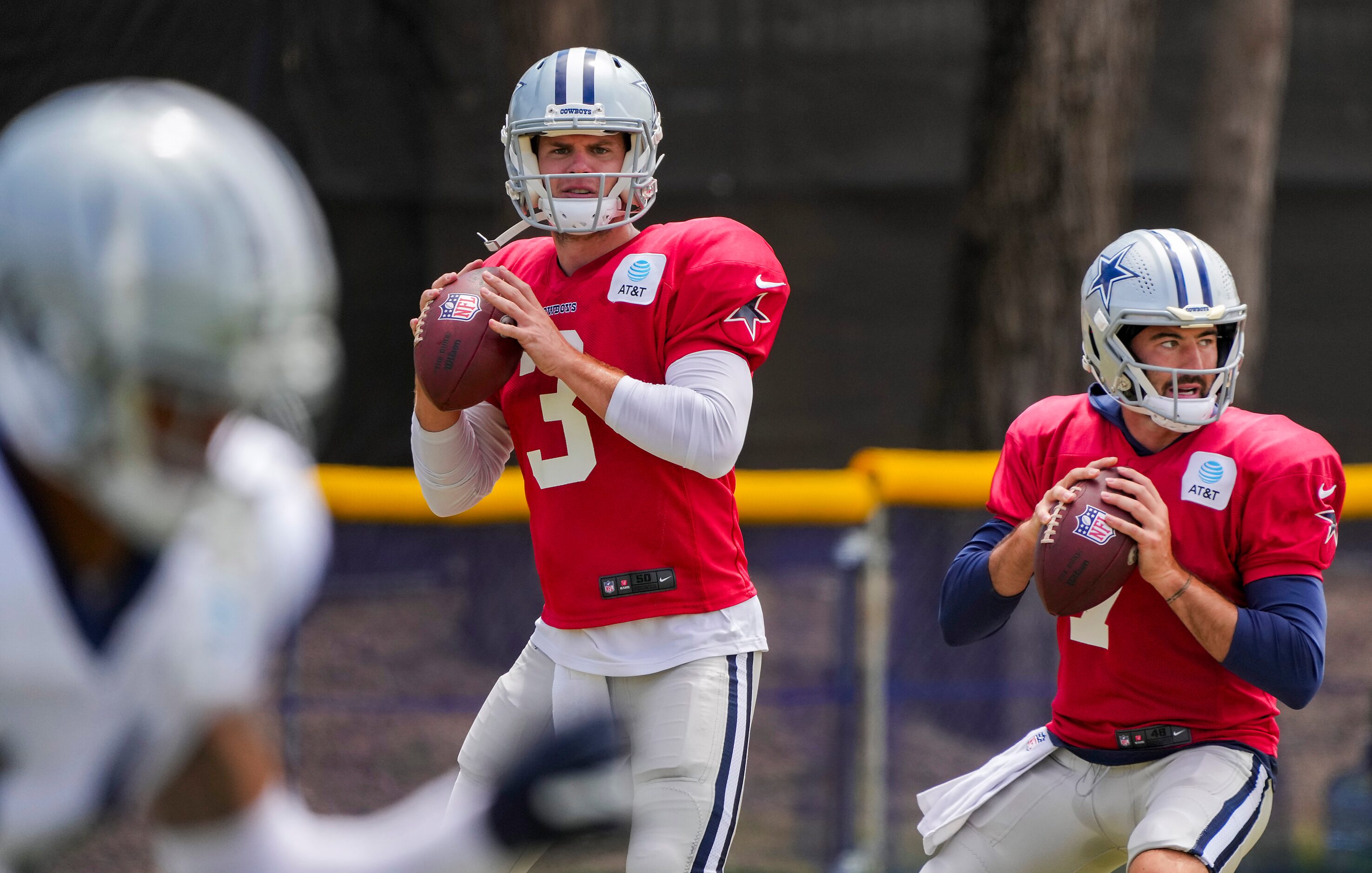 Dallas Cowboys quarterbacks Garrett Gilbert (3) and Ben DiNucci (7) prepare to throw passes...