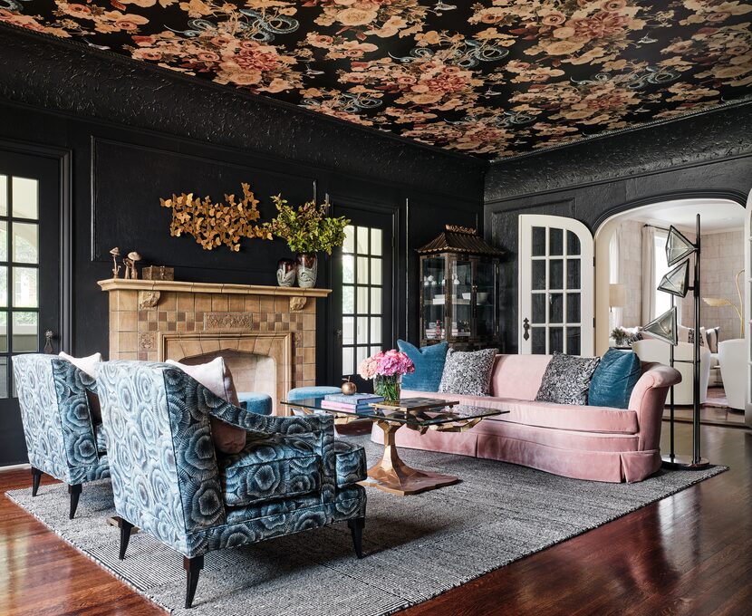 Traci Connell took bold pattern to new heights in this living room. The wallpapered ceiling...