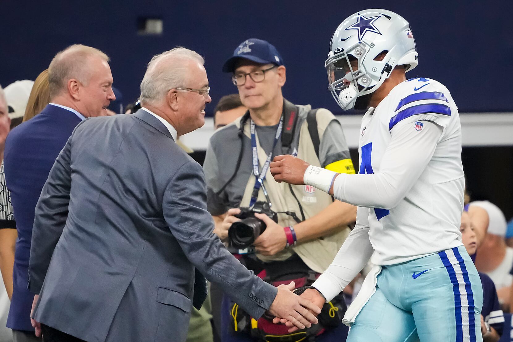 Detroit Lions players shake hands with fans after they defeated