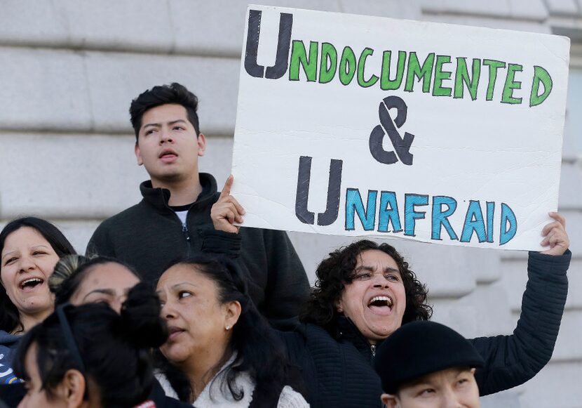 Lordes Reboyoso, right, yells at a rally outside of City Hall in San Francisco, Wednesday,...