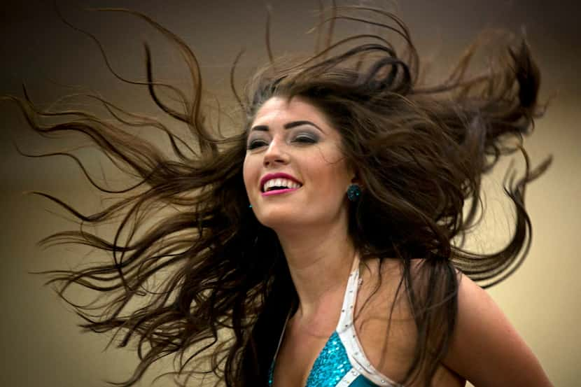 Victoria Jameson of Keller, Texas, flips her hair as she performs for judges during final...