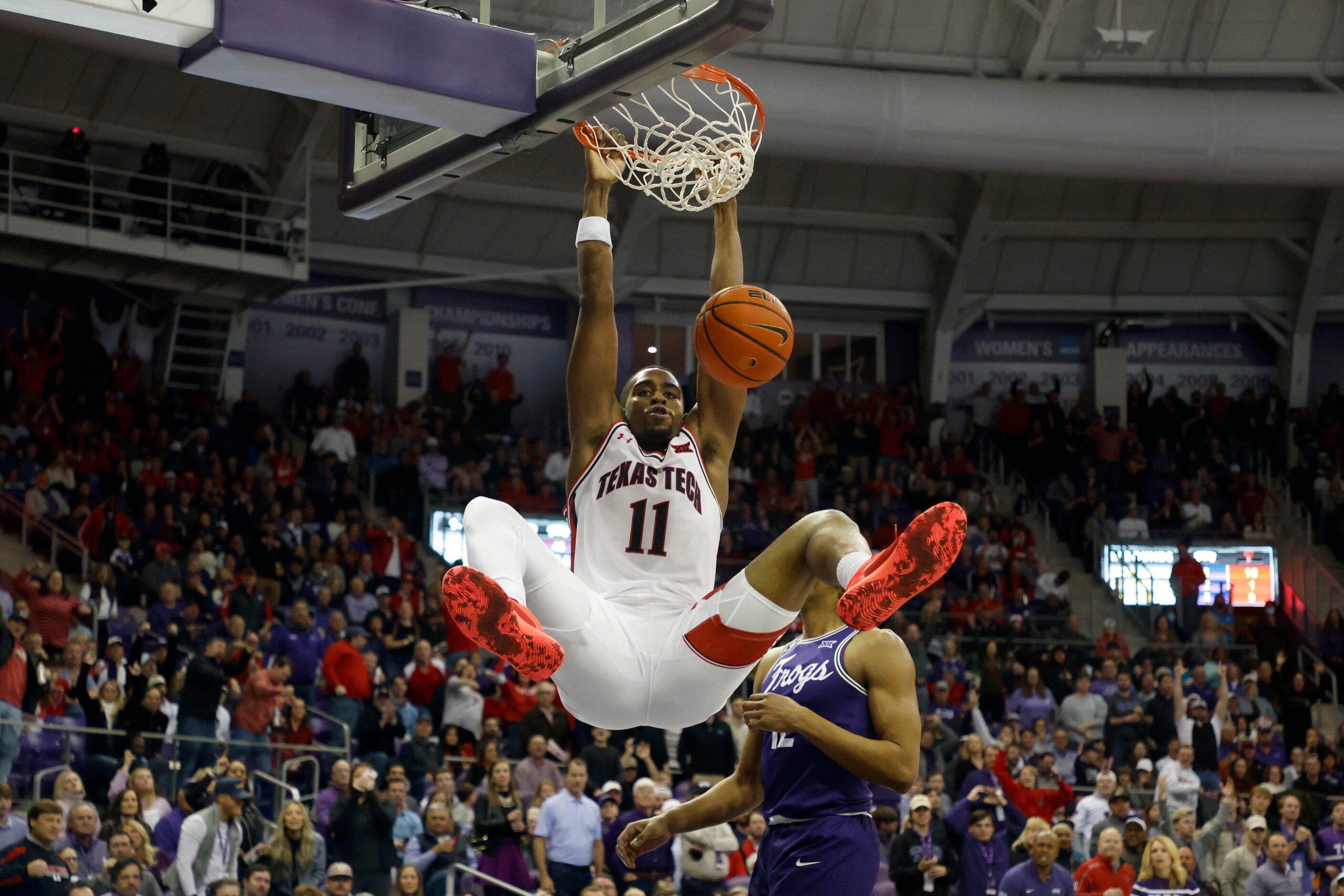 Texas Tech forward Bryson Williams (11) dunks against TCU during the first half of their...