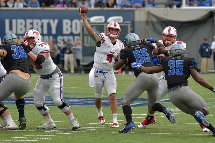 SMU quarterback Ben Hicks (8) passes the ball in the first half of an NCAA college football...
