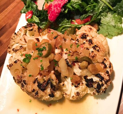 Cauliflower steaks with brown butter, golden raisins and cipollinis at Dish Preston Hollow