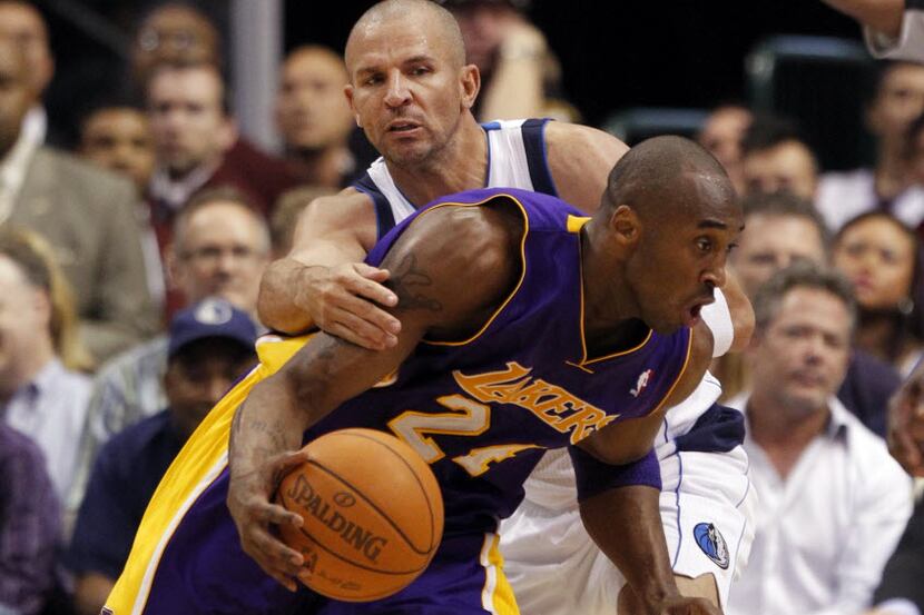 Dallas Mavericks point guard Jason Kidd (2) defends a driving Los Angeles Lakers shooting...