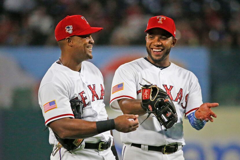 Texas Rangers third baseman Adrian Beltre (29) and shortstop Elvis Andrus (1) are pictured...