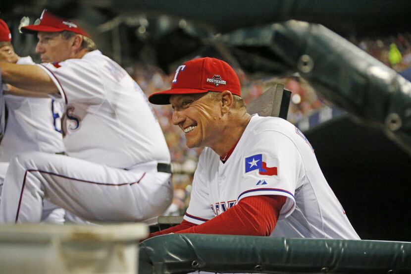 Texas Rangers manager Jeff Banister (28) sneaks a quick smile late in the game during Game 3...