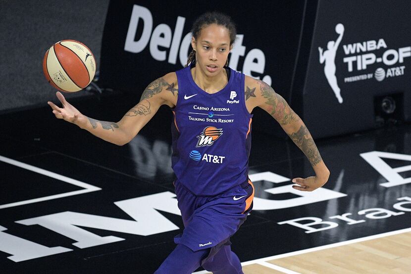 FILE - In this July 25, 2020, file photo, Phoenix Mercury center Brittney Griner grabs a...