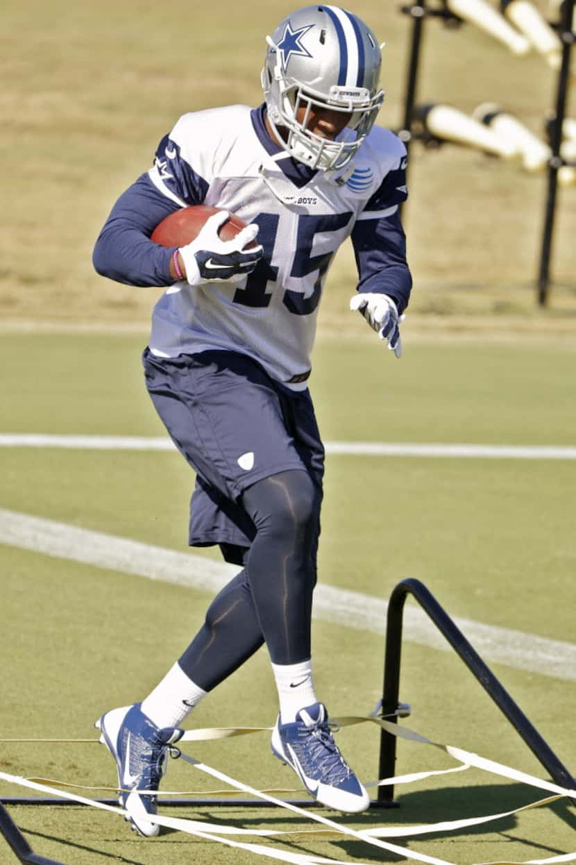 Rod Smith high steps through the ropes during Dallas Cowboys practice at Valley Ranch in...