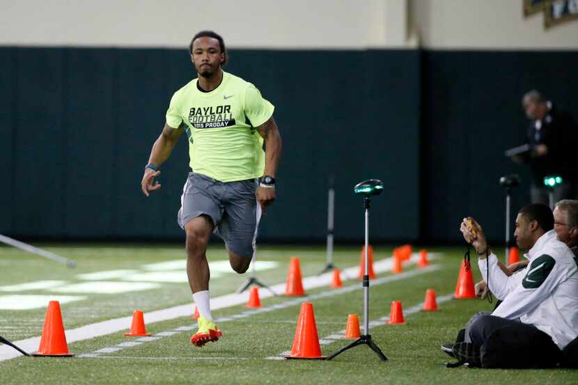 Levi Norwood runs the 40-yard dash as he works out for scouts at Baylor NFL football Pro Day...