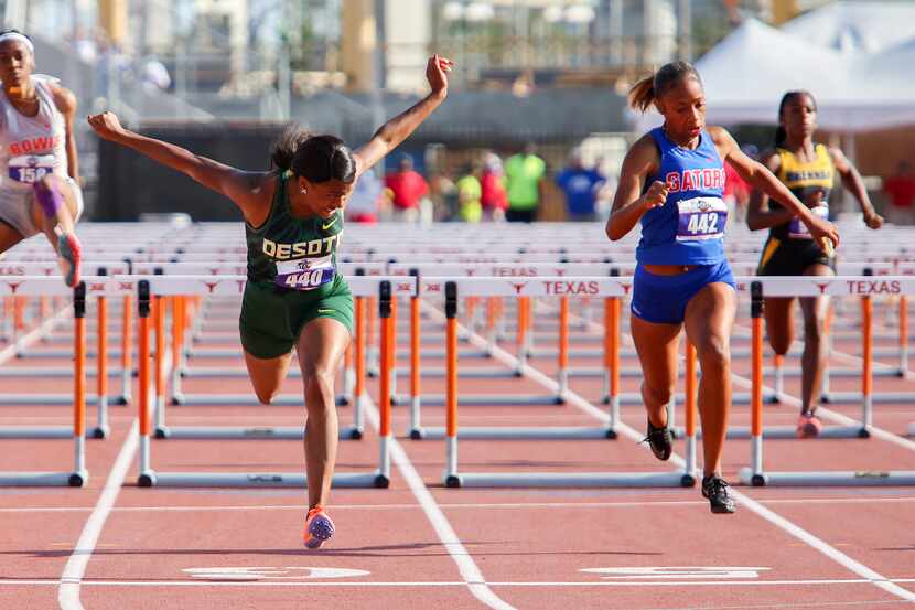 DeSoto's Jalaysi'ya Smith crosses the finish line in the 6A Girls 100 meter hurdles during...