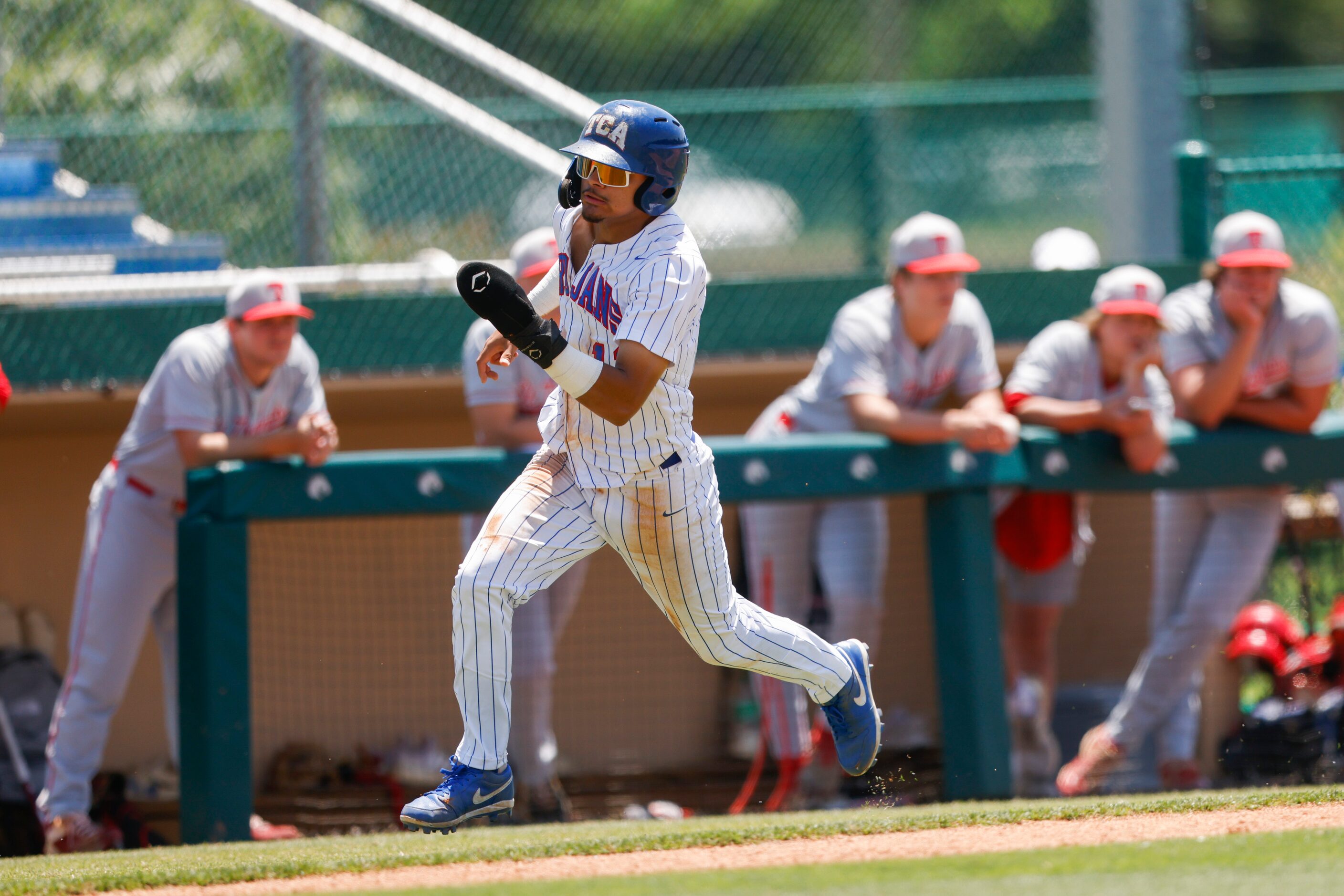 Trinity Christian’s Steven Ramos (12) runs to home in the third inning against Houston St....