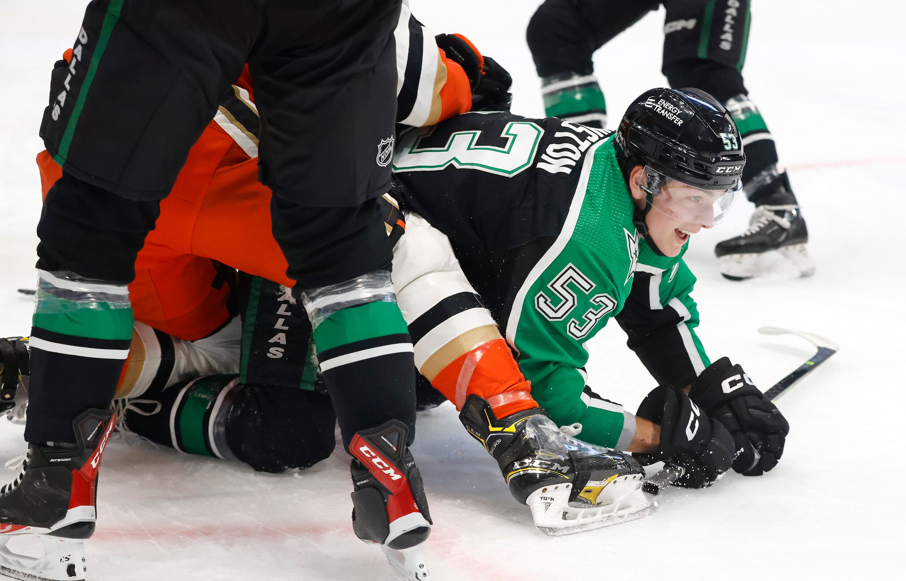 Dallas Stars center Wyatt Johnston (53) came up smiling after being checked into the boards...