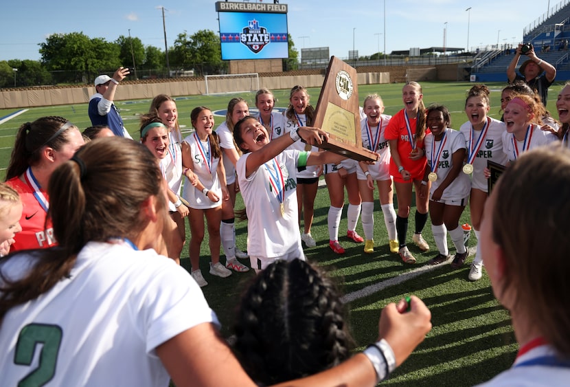  Prosper senior forward Brooklyn Miller (9) took center circle to lead the team celebration...