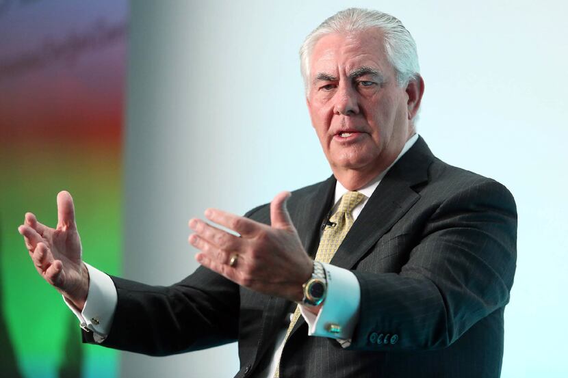 ExxonMobil CEO Rex Tillerson gestures as he speaks during the Oil and Money 2015 conference...