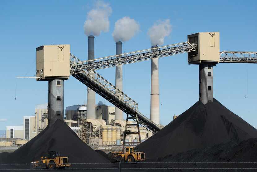 Piles of coal sit in front of Pacificorp's 1440 megawatt coal fired power plant on Oct. 9 in...