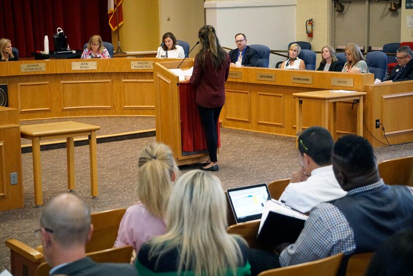 Richardson ISD's school board members listen to a speaker during a meeting about the...