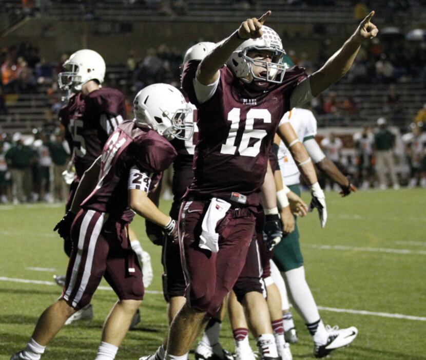 Plano Senior High's Mitchell Hansen (16) celebrates after running in a touchdown during the...