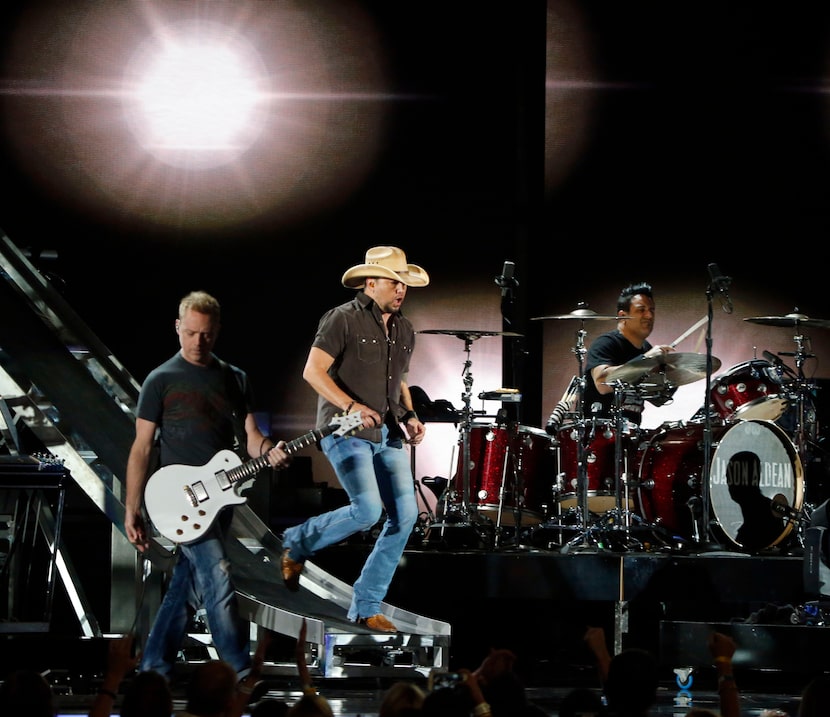 Aldean taking his risky slide ride at the ACMs. (Andy Jacobsohn/The Dallas Morning News)