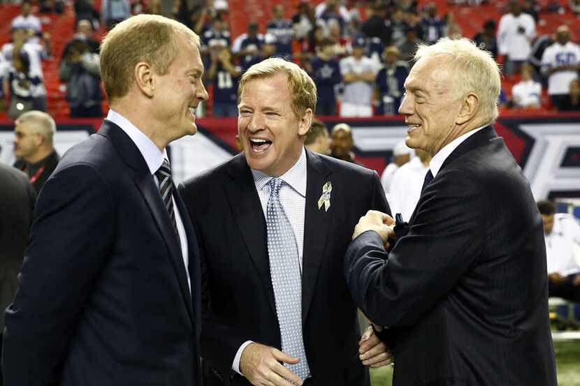 Dallas Cowboys owner Jerry Jones, right, and his son Jerry Jones Jr. laugh with NFL...