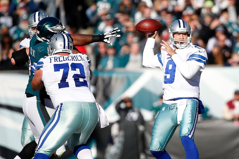 Dallas Cowboys quarterback Tony Romo (9) looks downfield to pass the ball against...