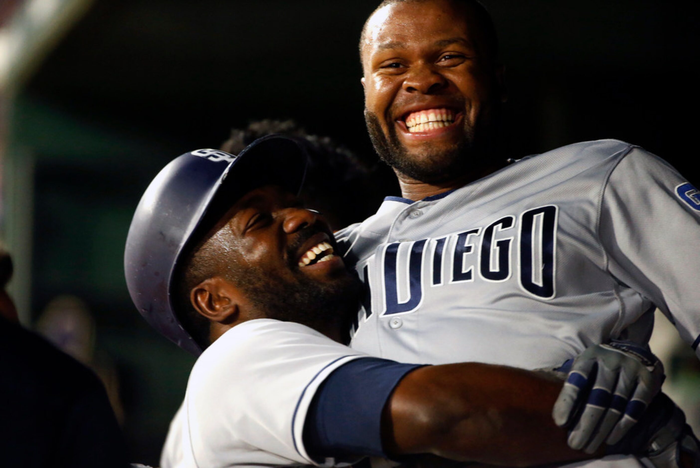 San Diego Padres Jose Pirela, left, celebrates with teammate Manuel Margot after hitting a...