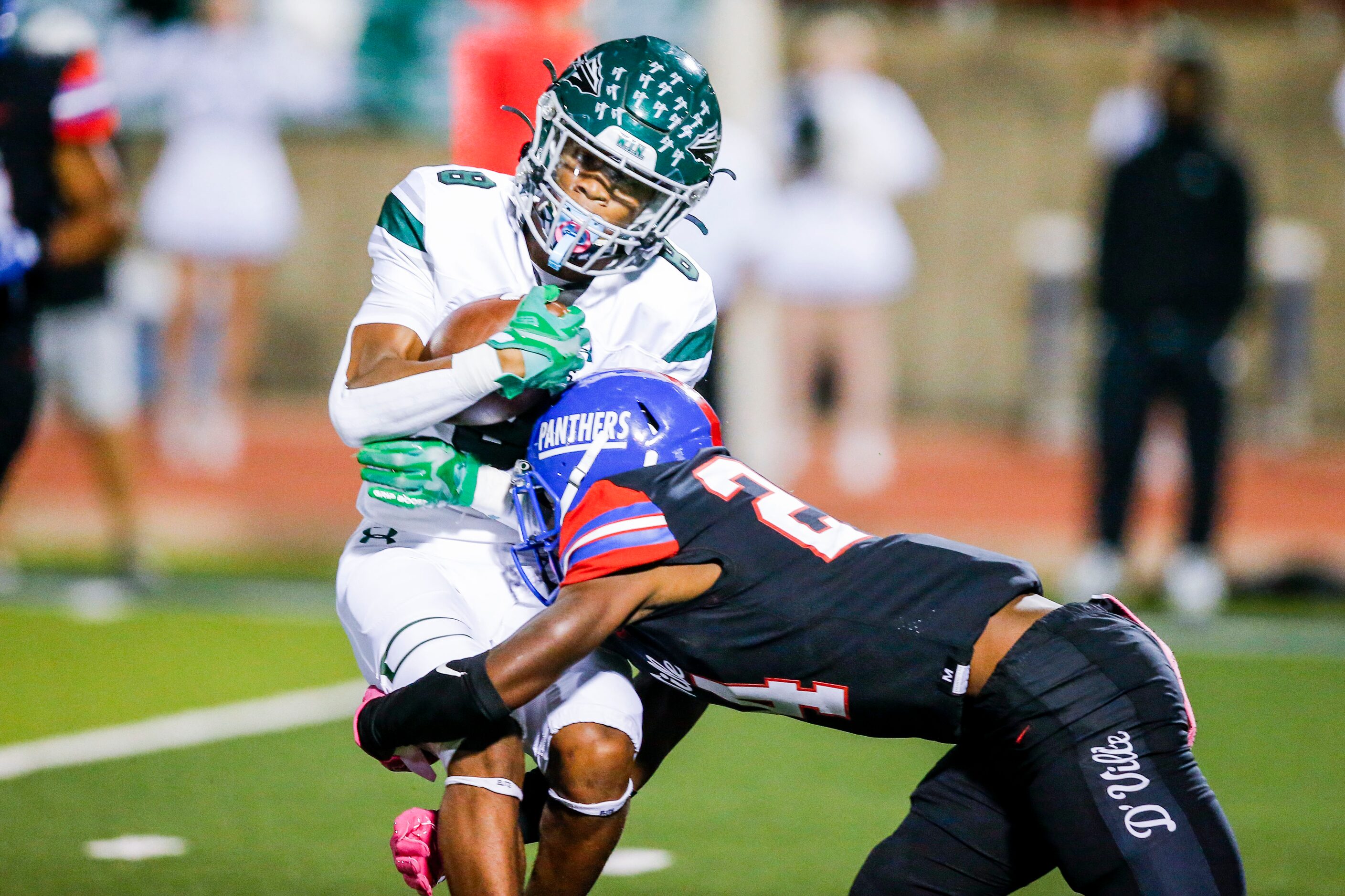 Duncanville sophomore defensive back Kadavion Dotson-Walker (24) tackles Waxahachie junior...