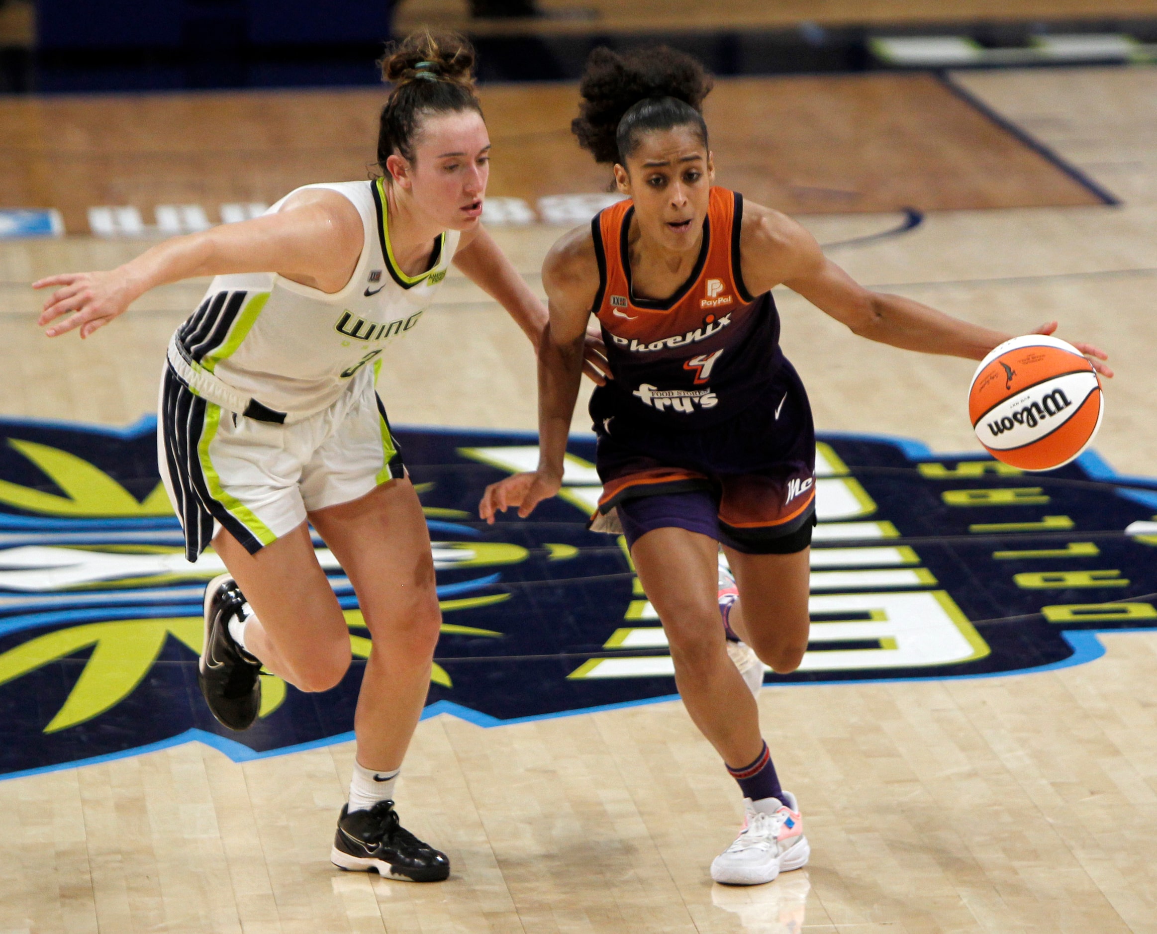 Phoenix guard Skylar Diggins-Smith (4) brings the ball up court as she is defended by Dallas...