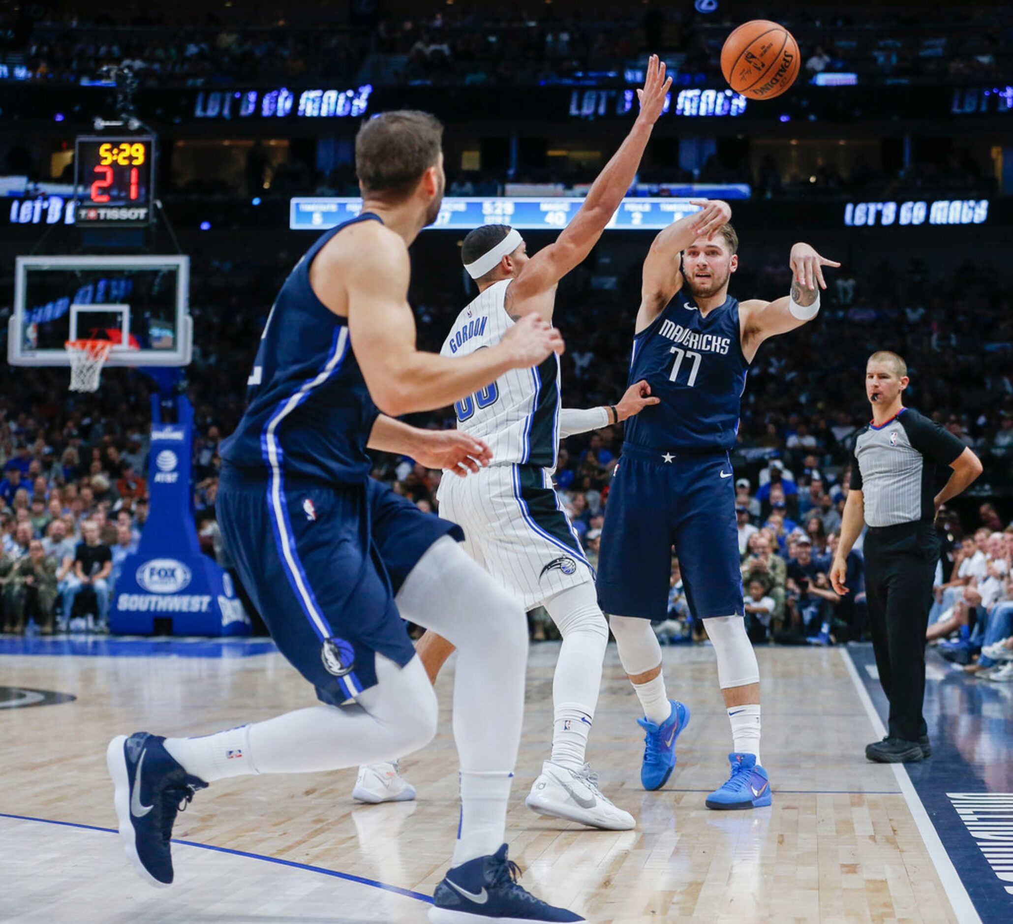 Dallas Mavericks guard Luka Doncic (77) fires off a pass to center Maxi Kleber (42) over...