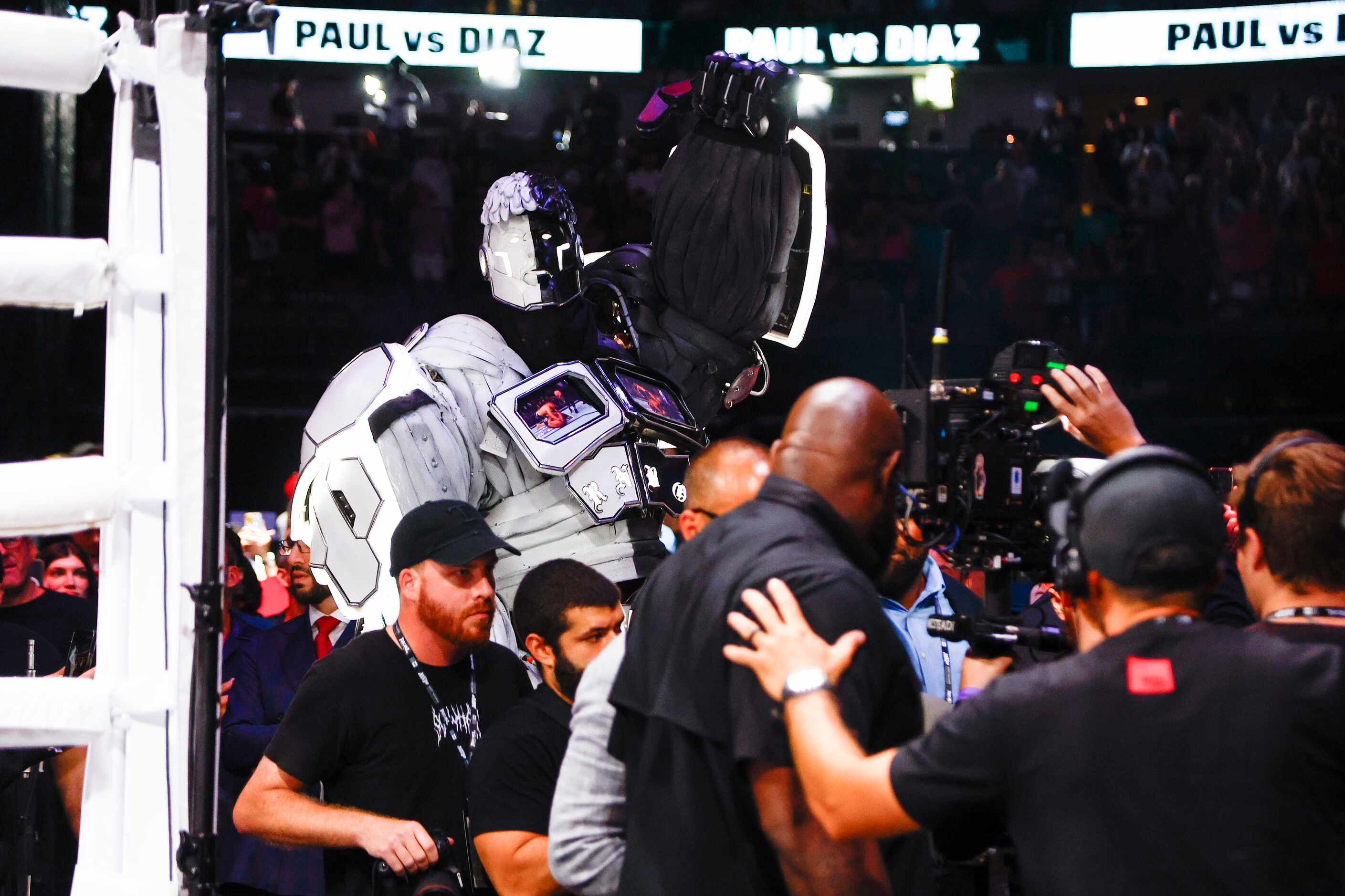 A large robot in the likeness of Jake Paul escorts the real Jake Paul, not pictured, to the...