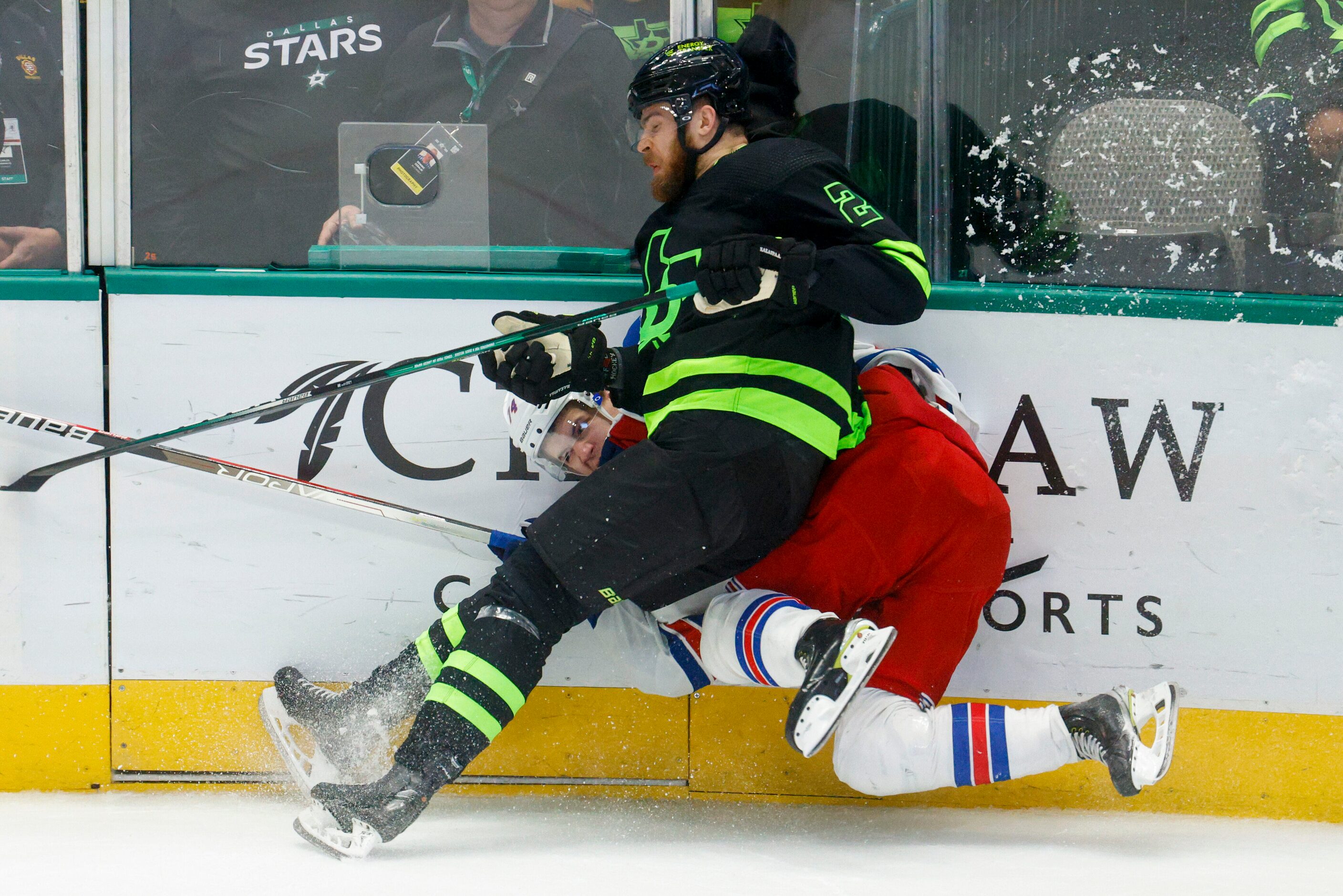 Dallas Stars defenseman Jani Hakanpaa (2) hits New York Rangers right wing Vitali Kravtsov...