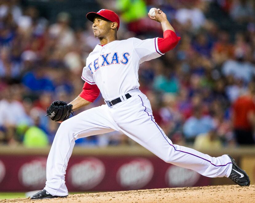 Texas Rangers relief pitcher Sam Freeman (71) pitches during the seventh inning of their...