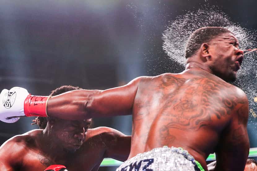 Charles Martin lands a punch on Gregory Corbin during a heavyweights match, one of the day's...