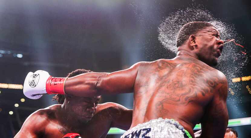 Charles Martin lands a punch on Gregory Corbin during a heavyweights match, one of the day's...