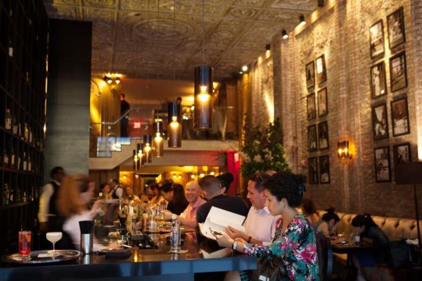 
Left: Betony, in Midtown, has a stunning dining room to match its cutting edge modern...