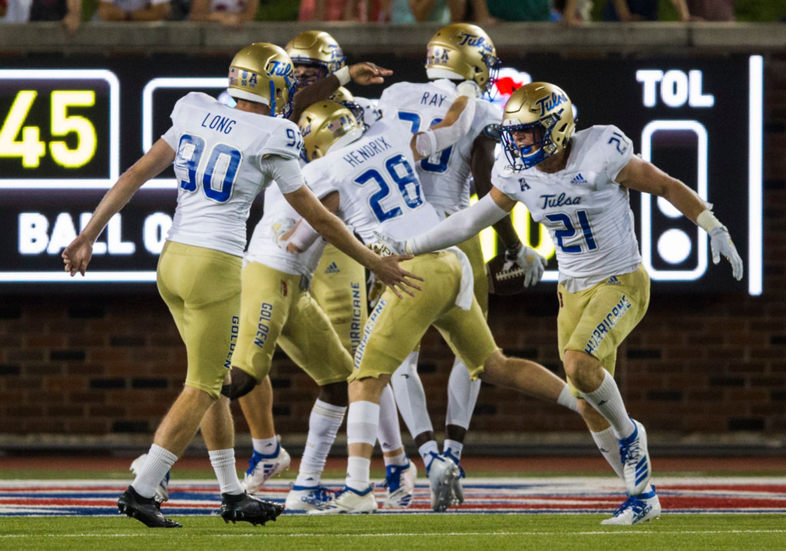 Tulsa Golden Hurricane players celebrate a touchdown during the second quarter of an NCAA...
