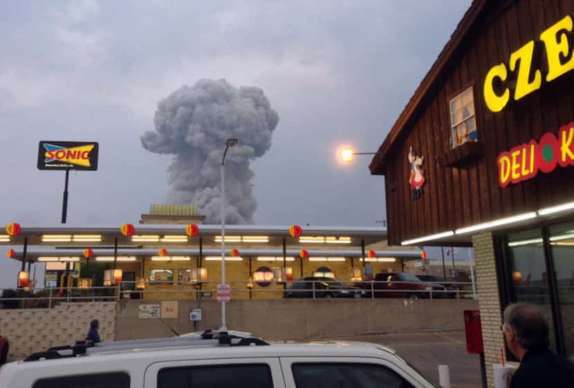 People at the Czech Stop in West, Texas watched a cloud of smoke rise Wednesday from an...