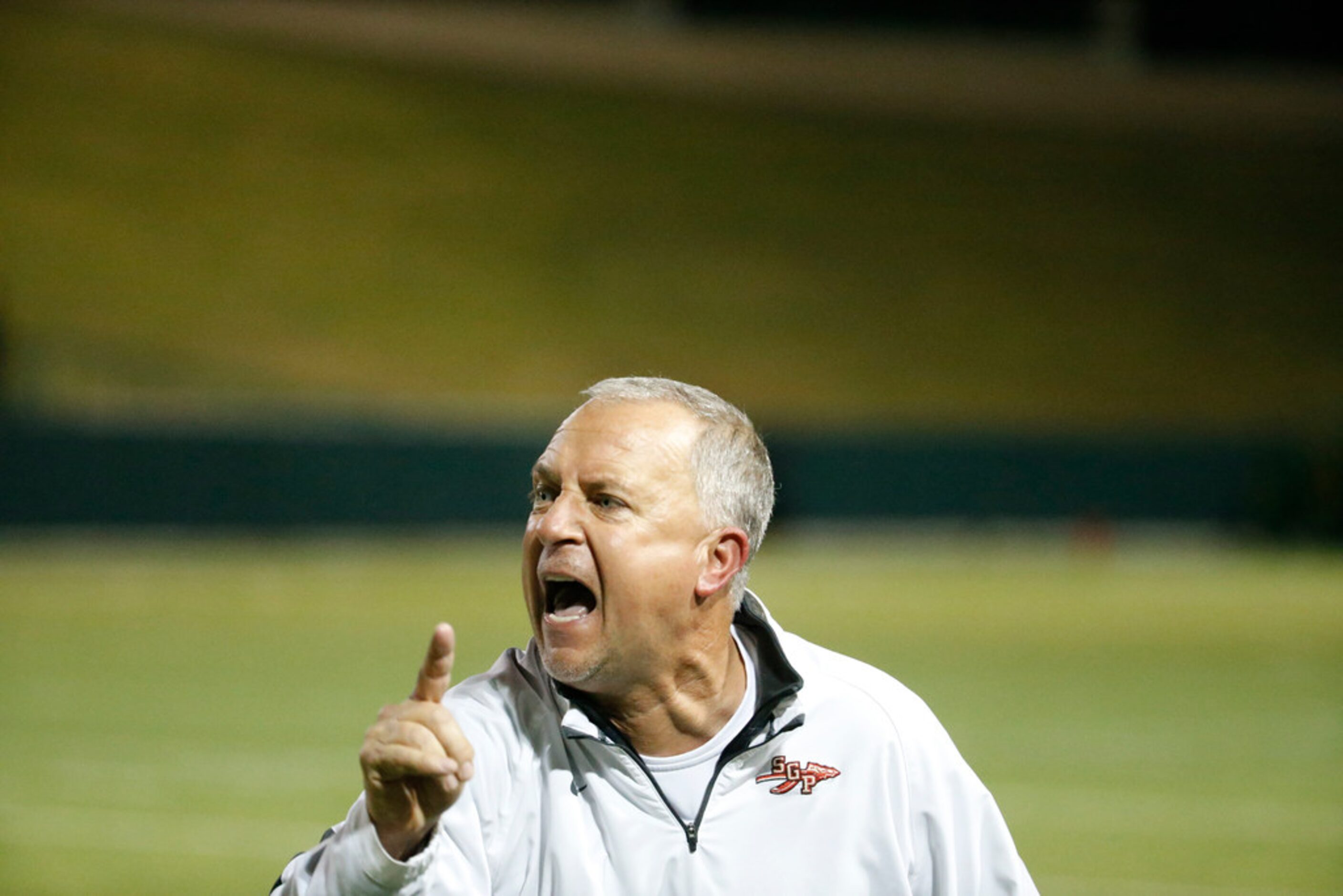 South Grand Prairie's head coach Brent Whitson yells during the second half game against...