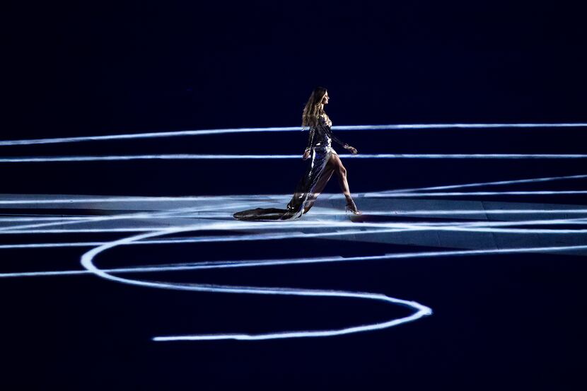 Model Gisele Bundchen crosses the floor of the stadium in a segment on "The Girl from...
