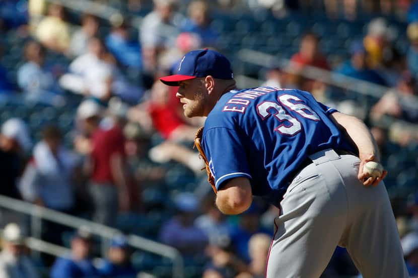 Texas Rangers pitcher Jon Edwards prepares to pitch during a Major League Baseball spring...