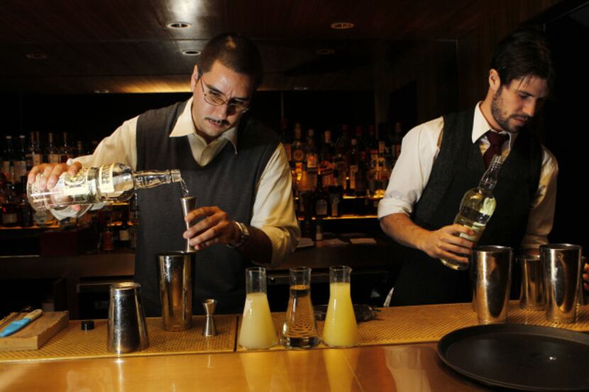 (from l to r) Josh Hendrix and Josh McEachern mix drinks at Smyth in Dallas on July 10,...
