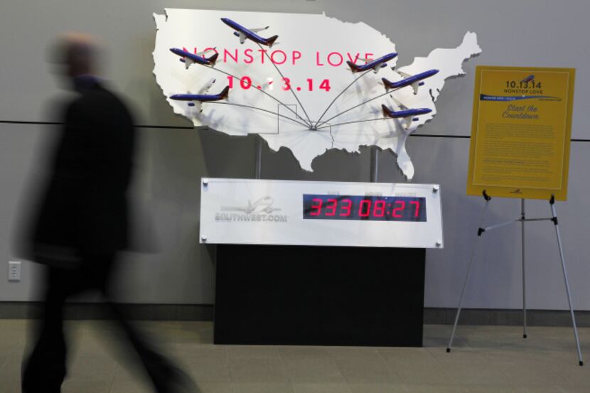 A clock in Southwest Airlines’ corporate lobby counts down the time until the Wright...