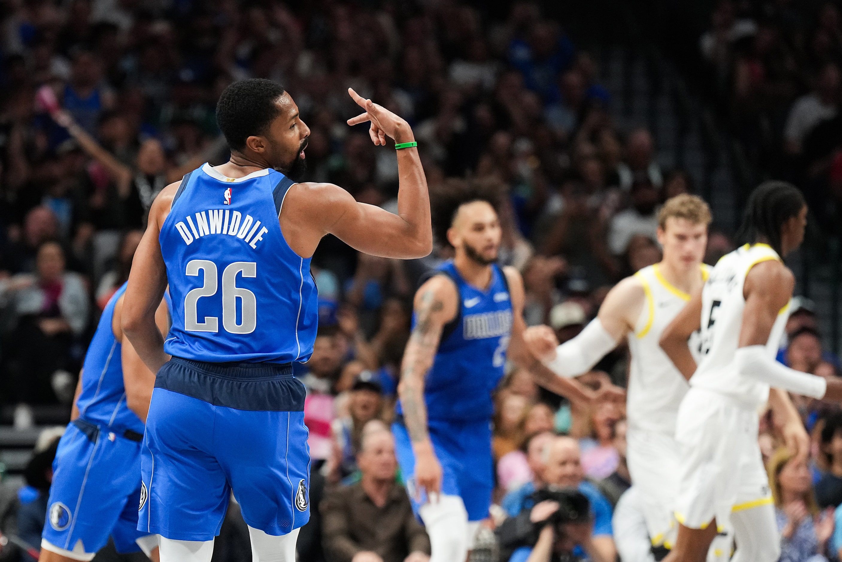 Dallas Mavericks guard Spencer Dinwiddie (26) celebrates after hitting a 3-pointer during...