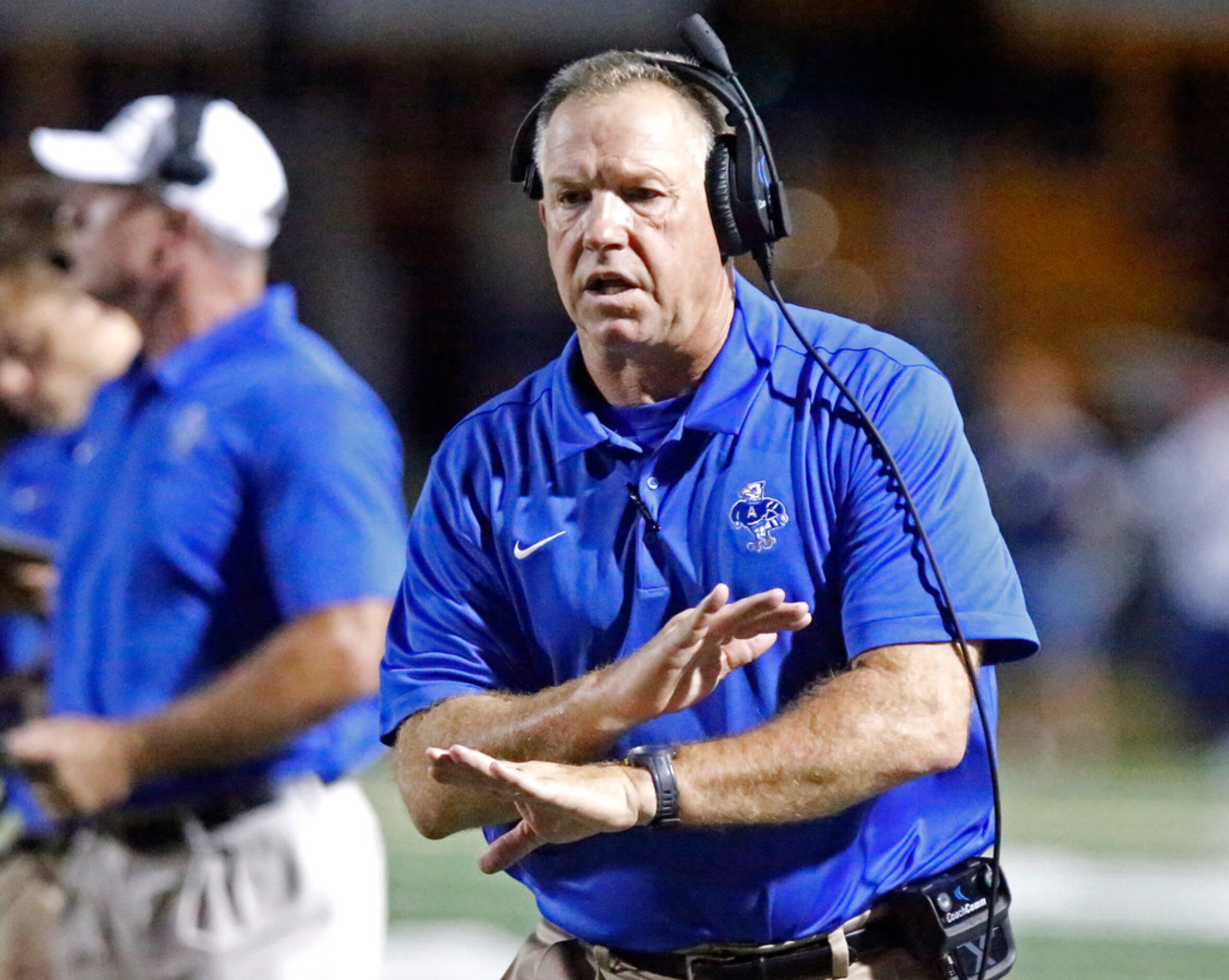 Allen High School head coach Terry Gambill reacts to a play on the field during the first...