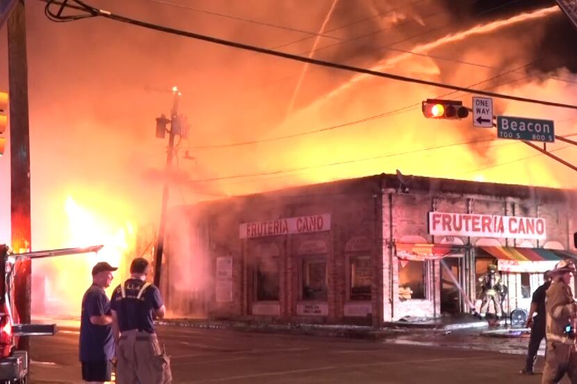 An overnight fire destroyed a building with at least two businesses. 