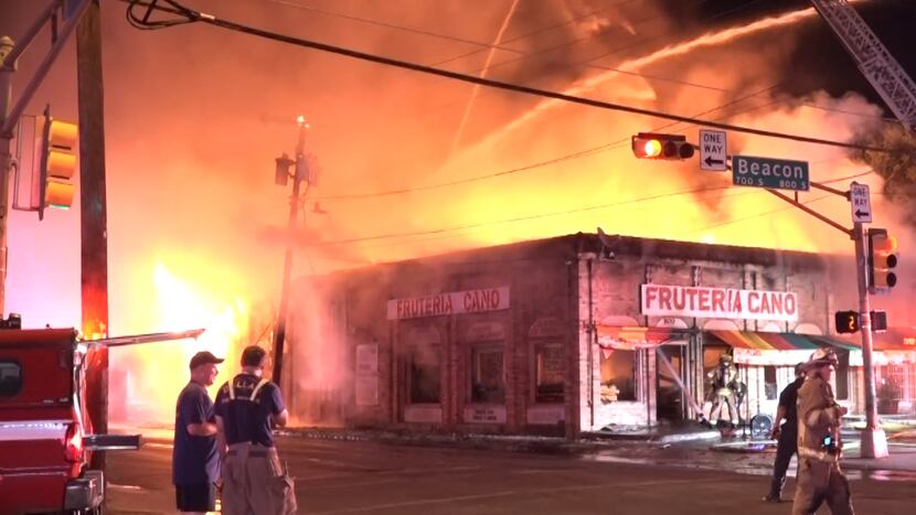 An overnight fire destroyed a building with at least two businesses. 