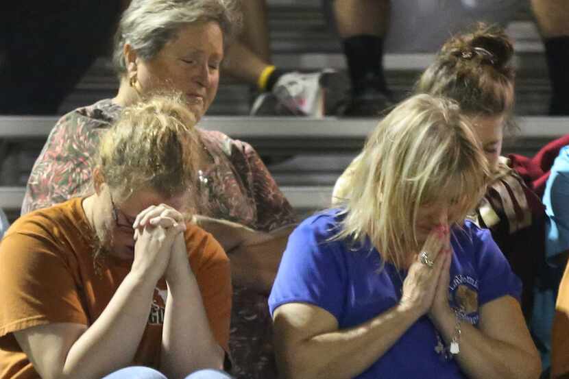 The crowd prays at a memorial service at LaVernia High School in La Vernia, Texas, up the...