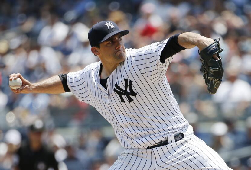 New York Yankees starting pitcher Nathan Eovaldi delivers during the first inning of a...