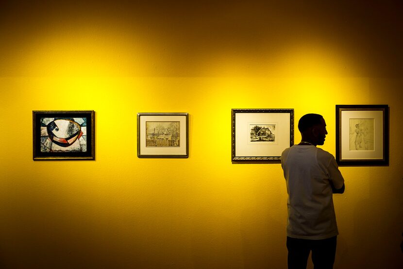 Khalil Kinsey looks over a gallery during the installation of The Kinsey Collection exhibit...