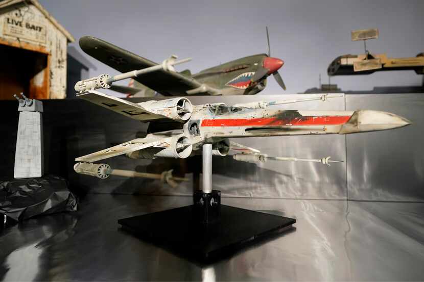 A miniature X-wing starfighter, pictured here, sold for more that $3.1 million Sunday at a...